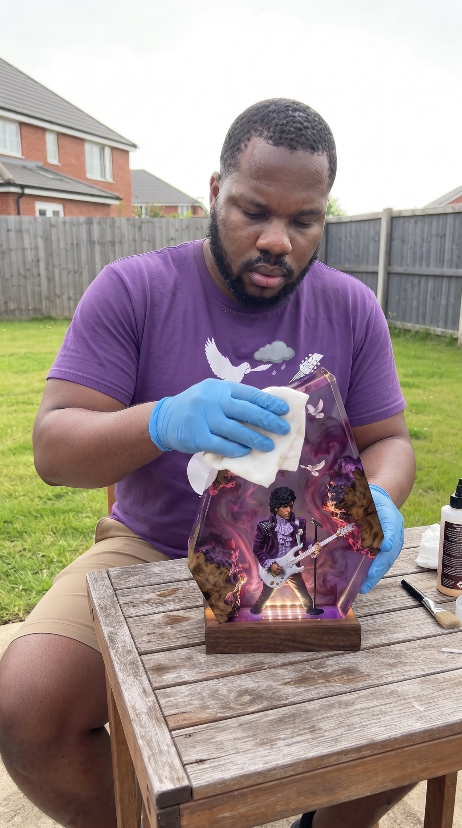 Larry holding the Purple Rain guitar resin lamp